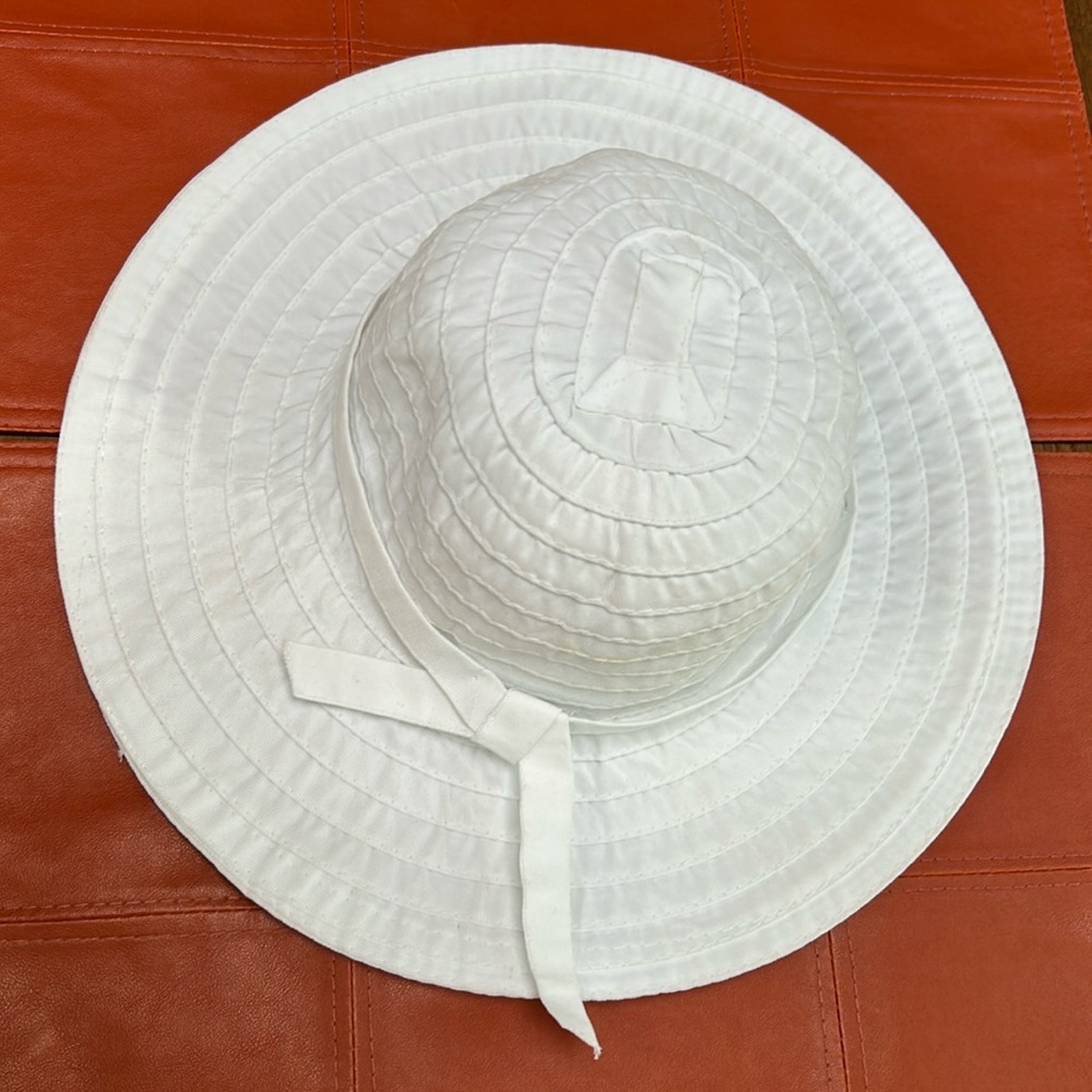SCALA Collections all white, one size, 4” brim, all washable polyester. Cute bow